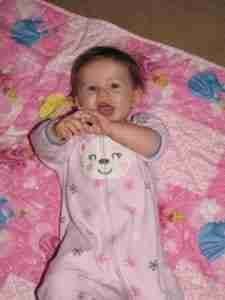 Abby on pink quilt