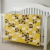 golden dinosaurs baby quilt on crib