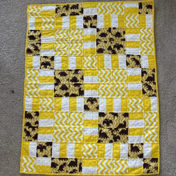 golden dinosaurs baby quilt full view