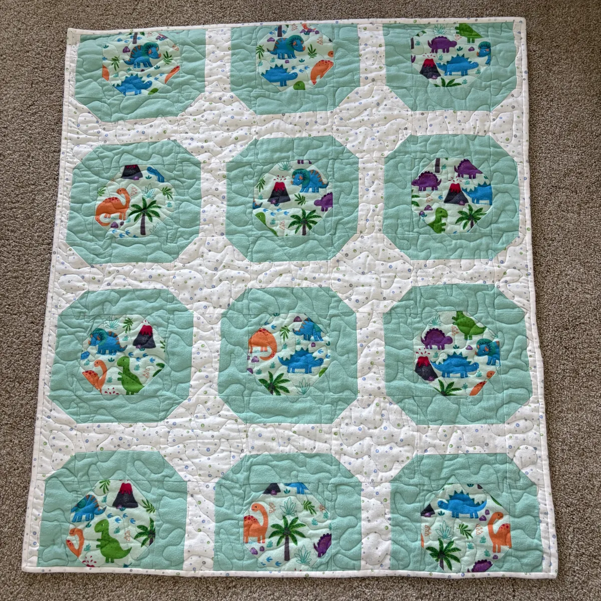 dinosaur world baby quilt full view