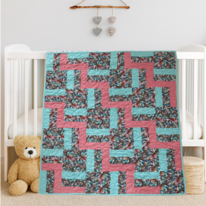 color blocks baby quilt on white crib