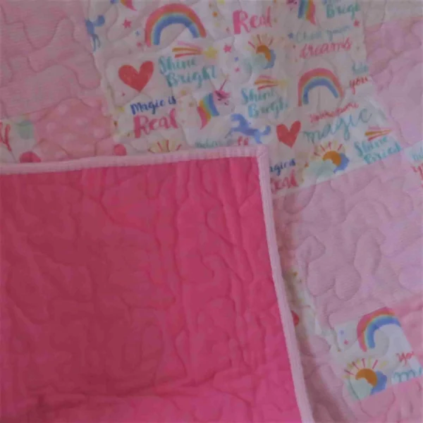 pink unicorn and rainbows baby quilt baking