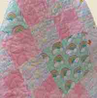 pink rainbows baby quilt