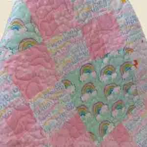 pink rainbows baby quilt