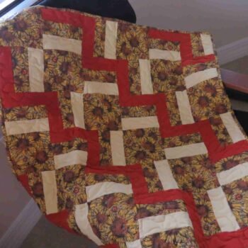 sunflowers baby quilt on chair
