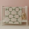 rosebud baby quilt on crib