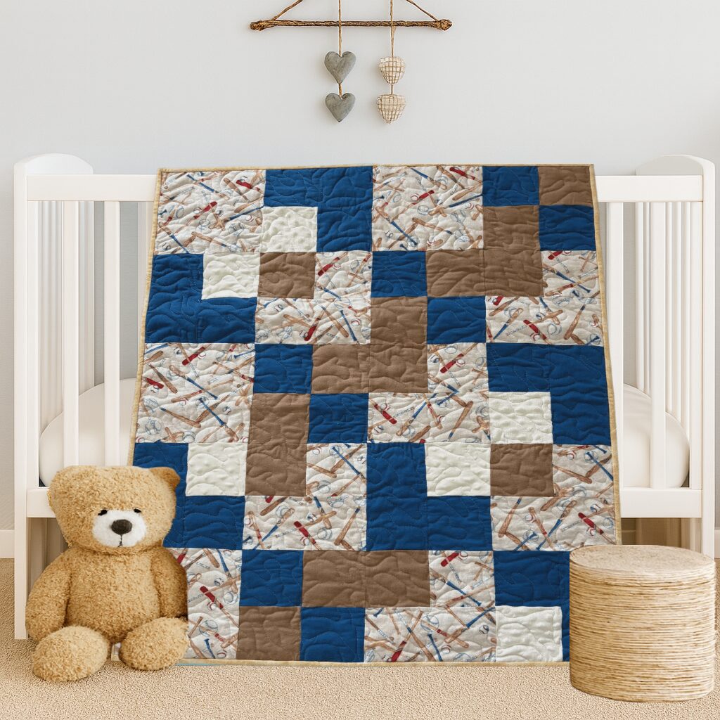 Baseball Games Baby Quilt draped on white crib with teddy bear