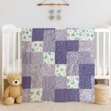 Butterfly Patches Baby Quilt on white crib with bear