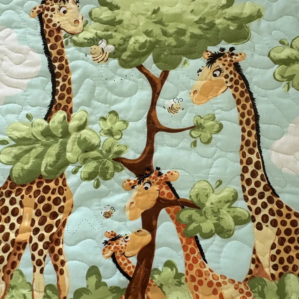 new giraffe family baby quilt detail 1