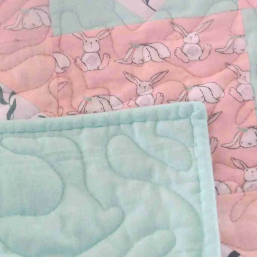 choosing the pink baby quilt
