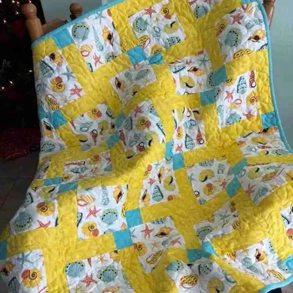 Seashells and Sand Baby Quilr on chair