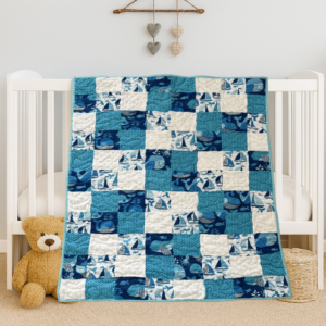 blue sailboats on white crib