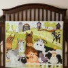 new barnyard buddies baby quilt on brown crib