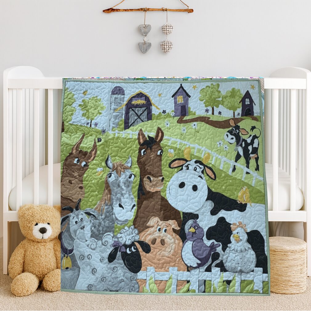 Barnyard Buddies Baby Quilt on white crib iwth teddy bear
