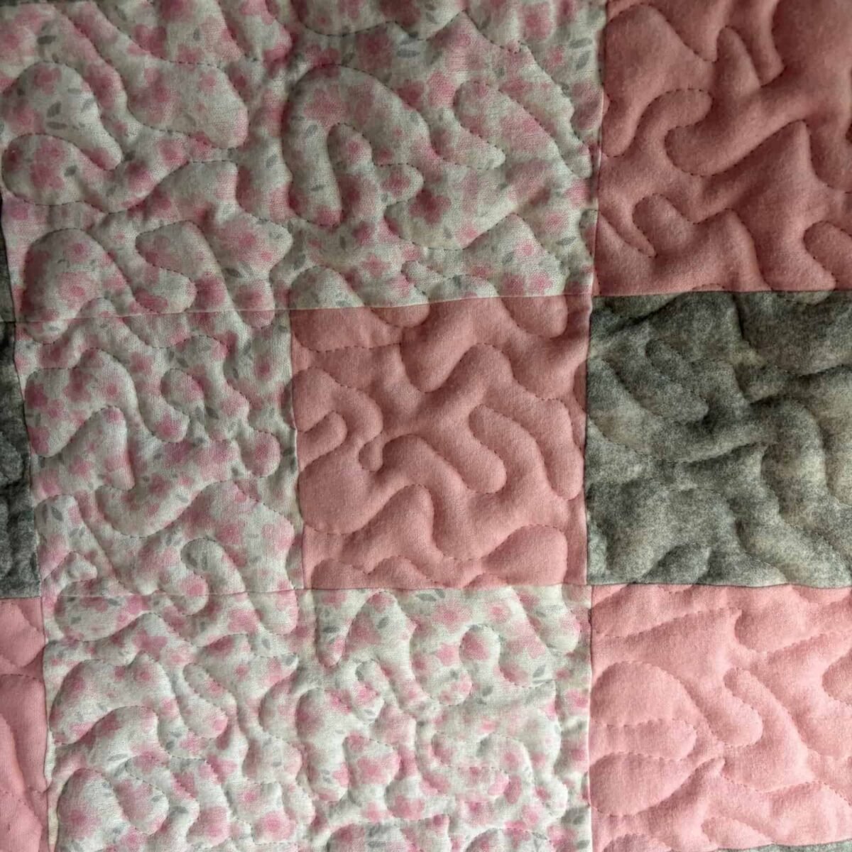 IBlush & Bloom Baby Quilt detail of solid and print squares