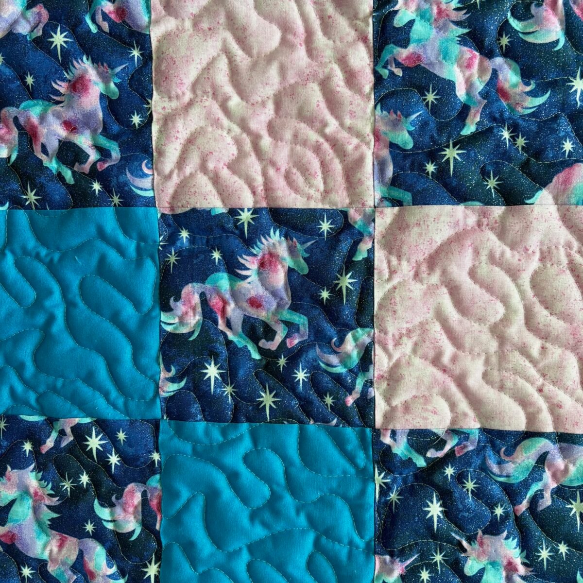Unicorn Patchwork Baby Quilt detail of solid and print squares