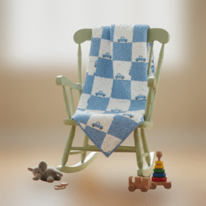 blue trucks baby quilt on chair