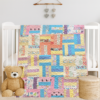 Handmade pastel patchwork quilt for toddlers featuring floral and animal prints.