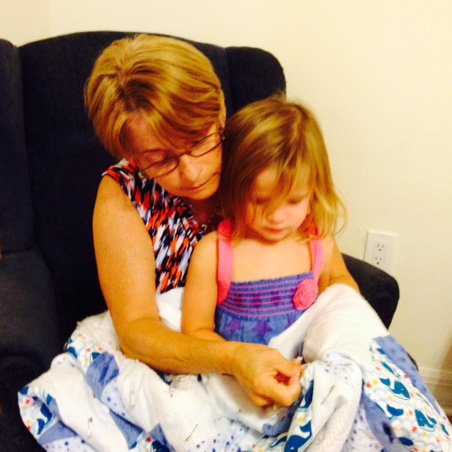 Abby and Grandma sewing
