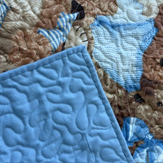 Blue Bears Baby Quilt with visible blue backing