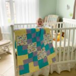 Animal ABC Baby Quilt in nursery with baby