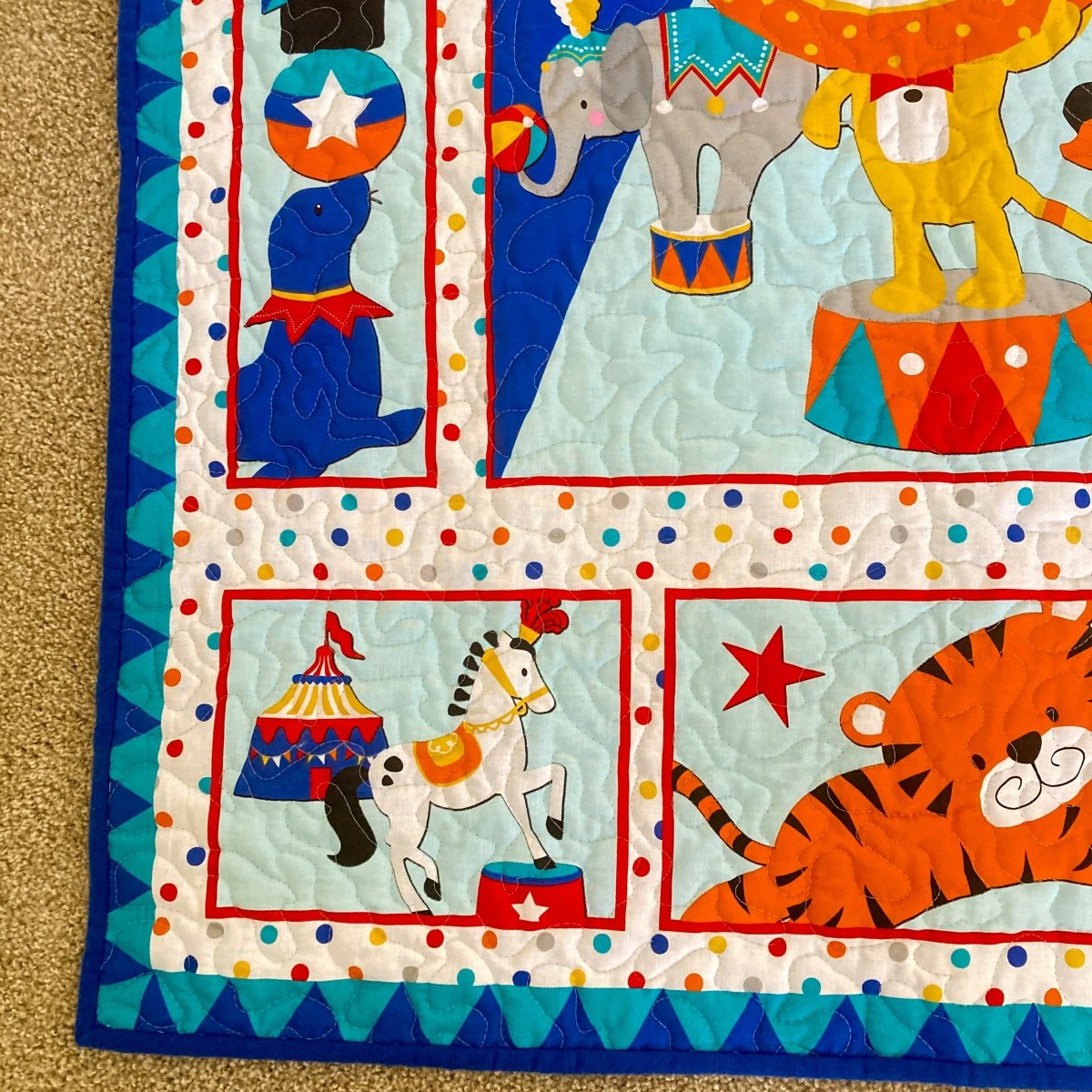 Circus Parade Baby Quilt with detail of poodle