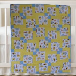 Seashells and Sand New Product Image on white crib